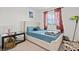 Bright bedroom featuring a cozy queen-sized bed, natural light, and tasteful decor at 3517 Arcadian King Ave, Las Vegas, NV 89106