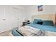 This bedroom has a plush queen-sized bed, ample closet space, and cozy, neutral decor at 3517 Arcadian King Ave, Las Vegas, NV 89106