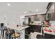 Well-lit kitchen features granite countertops, stainless steel appliances, and a spacious island with barstool seating at 3517 Arcadian King Ave, Las Vegas, NV 89106