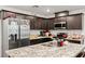 Spacious kitchen boasts granite countertops, stainless steel appliances, and ample cabinet space for storage at 3517 Arcadian King Ave, Las Vegas, NV 89106