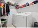 Functional laundry area with modern washer and dryer, shelving, and ample storage at 3517 Arcadian King Ave, Las Vegas, NV 89106