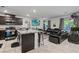 Open-concept living room with a seamless flow to the kitchen, perfect for modern living and entertaining at 3517 Arcadian King Ave, Las Vegas, NV 89106