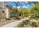 Picturesque street view showcasing lush landscaping with walking path and a community of stylish homes at 3517 Arcadian King Ave, Las Vegas, NV 89106