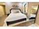 Comfortable main bedroom with a full bed, unique decor and a large mirror at 3722 Las Vegas Blvd # 809, Las Vegas, NV 89158