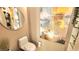 Cozy powder room with an artsy feel, decorated with plants, a mirror, and wall art at 3722 Las Vegas Blvd # 809, Las Vegas, NV 89158