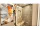 Luxurious walk-in shower with sleek tiling, a built-in bench, and glass enclosure at 3722 Las Vegas Blvd # 809, Las Vegas, NV 89158