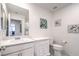 Clean bathroom with neutral cabinets, a sink, and a toilet at 4145 Nopal Serrano Ave, Las Vegas, NV 89141