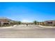 Welcome to Saguaro Ranch: a beautiful community entrance with lush landscaping and mountain views at 4145 Nopal Serrano Ave, Las Vegas, NV 89141