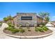 Welcome to Saguaro Ranch community sign with lush landscaping and sidewalk at 4145 Nopal Serrano Ave, Las Vegas, NV 89141