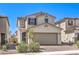 Charming two-story home with a two car garage and brick paved driveway at 4145 Nopal Serrano Ave, Las Vegas, NV 89141