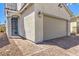 Close up of the 2-car garage and front door with brick paved driveway at 4145 Nopal Serrano Ave, Las Vegas, NV 89141
