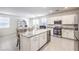 Bright kitchen area with stainless steel appliances and a view into the living room at 4145 Nopal Serrano Ave, Las Vegas, NV 89141