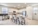 Modern kitchen with a large island and breakfast bar seating at 4145 Nopal Serrano Ave, Las Vegas, NV 89141
