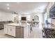 Open kitchen layout with stainless steel appliances and granite countertops at 4145 Nopal Serrano Ave, Las Vegas, NV 89141