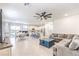 Spacious living room and kitchen area with modern ceiling fan at 4145 Nopal Serrano Ave, Las Vegas, NV 89141