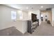 Bright loft area features neutral decor, comfortable carpet, and media center at 4145 Nopal Serrano Ave, Las Vegas, NV 89141
