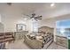 Relaxing main bedroom featuring a comfortable bed, soft carpet, and ceiling fan at 4145 Nopal Serrano Ave, Las Vegas, NV 89141