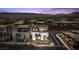 Overhead view of modern home in a suburban neighborhood surrounded by desert landscape and mountains at 4153 Solace St, Las Vegas, NV 89135