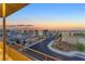 Elevated view of a neighborhood street showing roof lines, desert landscaping, and dusk sky at 4153 Solace St, Las Vegas, NV 89135