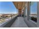 Outdoor balcony with stainless steel railing offering a panoramic view of the surrounding neighborhood at 4153 Solace St, Las Vegas, NV 89135