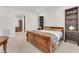Bedroom with an ornate wood bed and dark wood cabinets at 4153 Solace St, Las Vegas, NV 89135