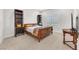 Comfortable bedroom with carpeted floors and two dark wood cabinets at 4153 Solace St, Las Vegas, NV 89135