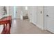 Open foyer featuring tile flooring, staircase, and hallway doors at 4153 Solace St, Las Vegas, NV 89135
