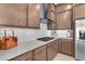 Modern kitchen with stainless steel appliances, gas range, and bright countertops at 4153 Solace St, Las Vegas, NV 89135