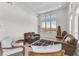 Living room with high ceilings and mountain views through large windows at 4153 Solace St, Las Vegas, NV 89135