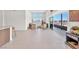 Spacious living area with access to balcony, tile floors and modern decor at 4153 Solace St, Las Vegas, NV 89135