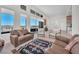 Spacious living room featuring tile floors, high ceilings, and access to a balcony at 4153 Solace St, Las Vegas, NV 89135