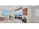 Bright living room with large windows, high ceilings, and access to a balcony at 4153 Solace St, Las Vegas, NV 89135