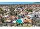 Expansive aerial view of a neighborhood featuring mature landscaping, private pools, and diverse home styles in a vibrant community at 4302 Newhaven Dr, Las Vegas, NV 89147