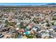 A vibrant community is showcased with a diverse range of homes, lush greenery, and inviting private pools amid a tranquil setting at 4302 Newhaven Dr, Las Vegas, NV 89147