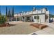 Spacious backyard featuring gravel landscaping, concrete patio, and a covered patio area at 4302 Newhaven Dr, Las Vegas, NV 89147