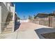 Large backyard area with ample parking space and stairs at 4302 Newhaven Dr, Las Vegas, NV 89147