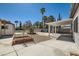 Landscaped backyard with covered patio area, storage shed, and well-manicured lawn at 4302 Newhaven Dr, Las Vegas, NV 89147