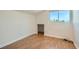 Neutral bedroom features wood floors, white trim, and a window for natural light at 4302 Newhaven Dr, Las Vegas, NV 89147