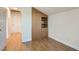 Bedroom featuring wood floors, closet with built-in shelving, and neutral walls at 4302 Newhaven Dr, Las Vegas, NV 89147