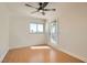 Well-lit bedroom with wood floors, crown molding, a ceiling fan, and access to a private balcony at 4302 Newhaven Dr, Las Vegas, NV 89147