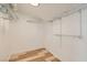 A walk-in closet featuring wire shelving and laminate flooring, offering ample storage and organization space at 4302 Newhaven Dr, Las Vegas, NV 89147