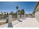 Spacious balcony with a view of palm trees and a community pool, perfect for outdoor living at 4302 Newhaven Dr, Las Vegas, NV 89147