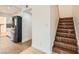 Entryway with tile steps, stainless steel refrigerator, and a peek into the light and bright kitchen at 4302 Newhaven Dr, Las Vegas, NV 89147