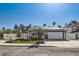 Inviting single-story home features a manicured lawn, solar panels, and a two-car garage at 4302 Newhaven Dr, Las Vegas, NV 89147