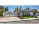 Attractive single-story home with metal security gates, a manicured lawn, and a two-car garage at 4302 Newhaven Dr, Las Vegas, NV 89147