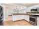 Bright and updated kitchen with stainless appliances and a pass-through to a dining and living area at 4302 Newhaven Dr, Las Vegas, NV 89147