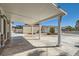 Covered patio providing shade and views of the backyard, featuring a pool and landscaped area at 4302 Newhaven Dr, Las Vegas, NV 89147