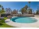 Enjoy this backyard pool, offering a relaxing retreat and a stone firepit area for cool evenings at 4302 Newhaven Dr, Las Vegas, NV 89147