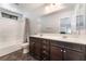 Bathroom boasts a double sink vanity, large mirror, and a shower-tub combination at 4650 Ranch House Rd # 86, North Las Vegas, NV 89031