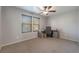 Bright bedroom features neutral paint, a ceiling fan, and two windows providing plenty of natural light at 4650 Ranch House Rd # 86, North Las Vegas, NV 89031